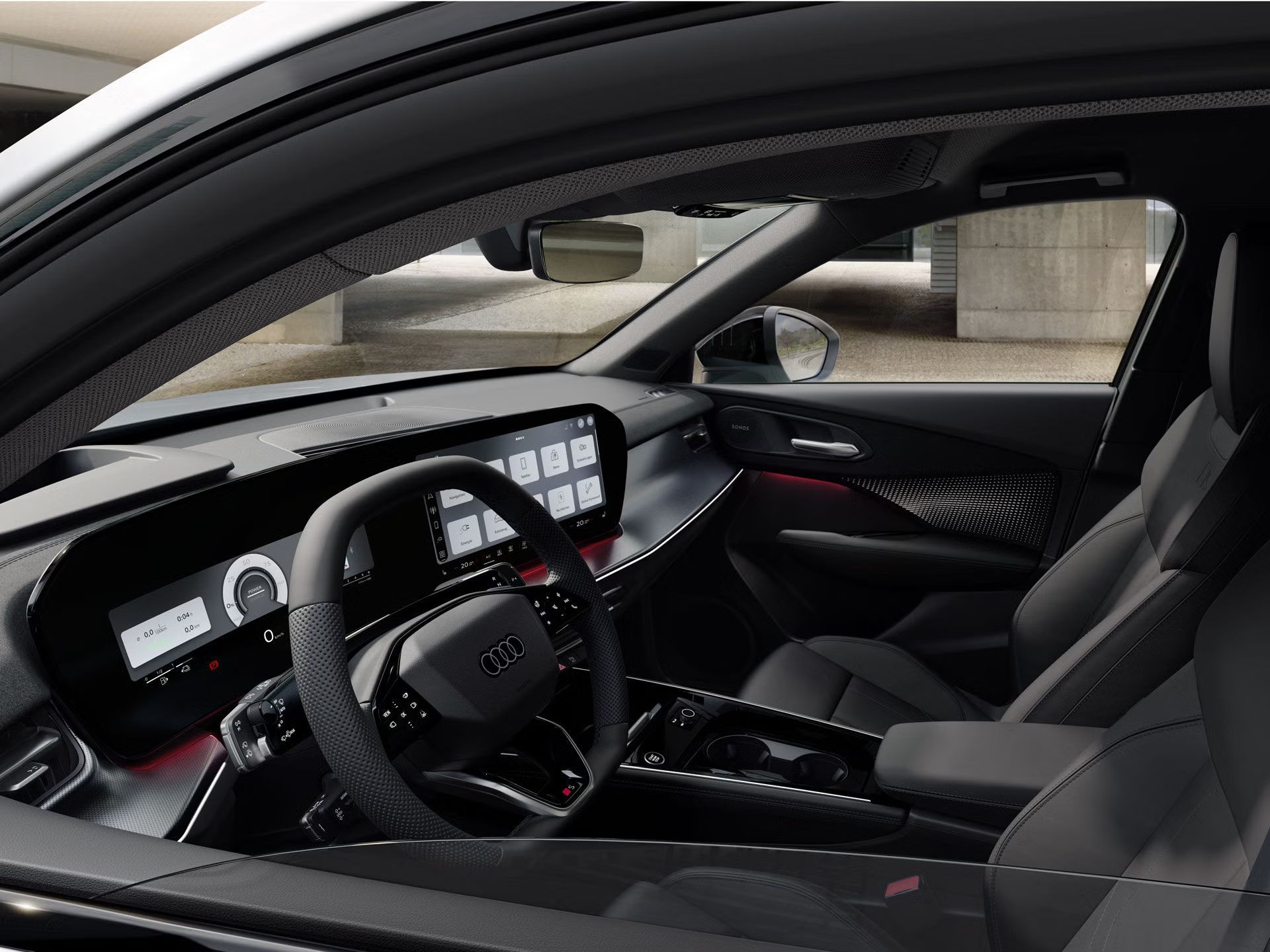 Blick von draußen durch die heruntergelassene Fensterscheibe auf das Lenkrad, Mittelkonsole und digitale Displays.	