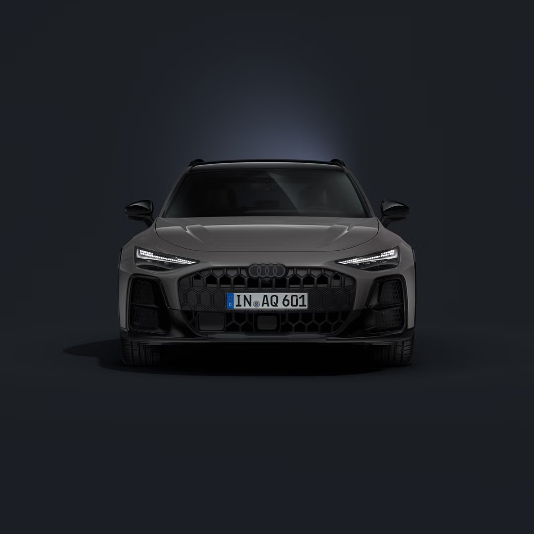 Audi A6 allroad, pogled od spredaj na temnem ozadju.